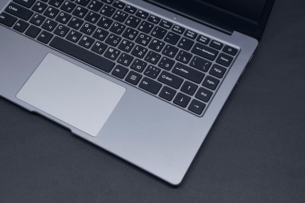 Open laptop on a black background closeup