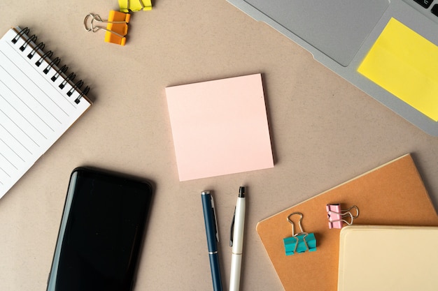 Open laptop with blank notebook, top view. Workplace concept