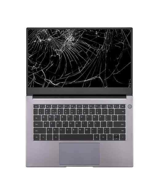 Open laptop with a broken, cracked screen isolated on white background close up top view