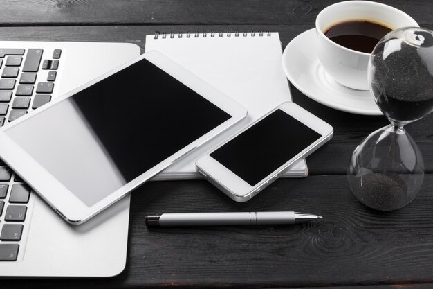 open laptop with digital tablet and smartphone close up