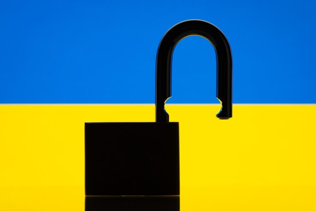 Open lock against flag of ukraine