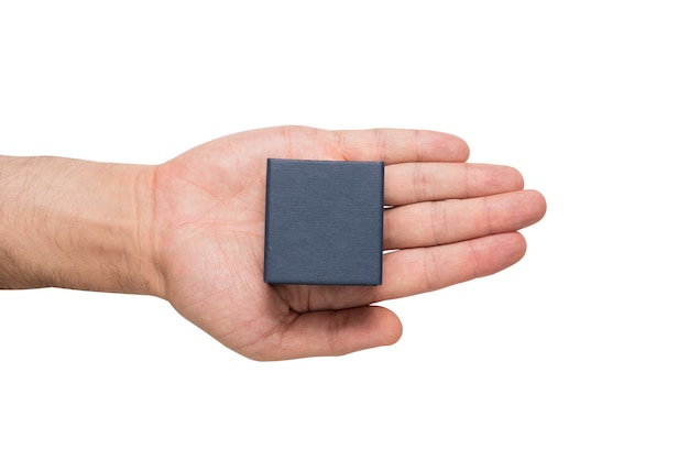 Open male palm with a black square box. Present. White wall