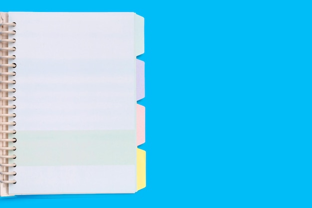 Open notebook on blue background