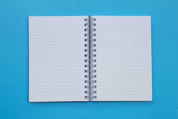 Open notebook on blue