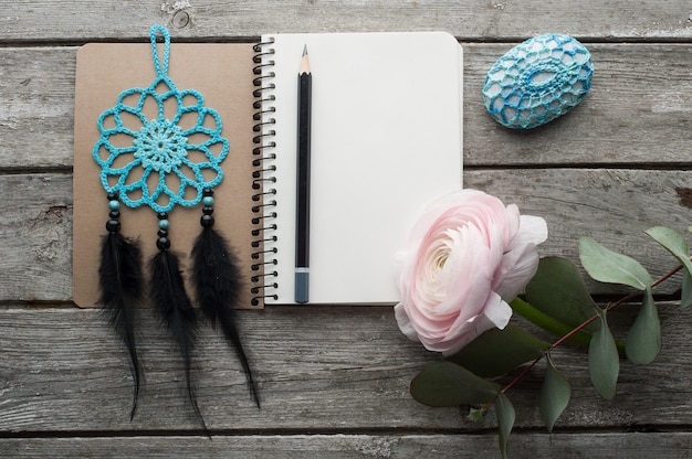 Open notebook, dream catcher