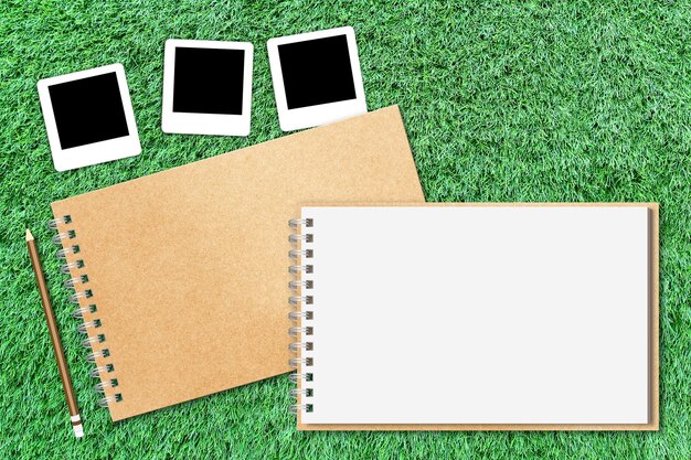 open notebook on green grass