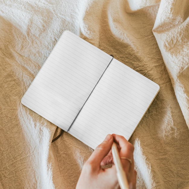 open notebook png mockup on linen blanket