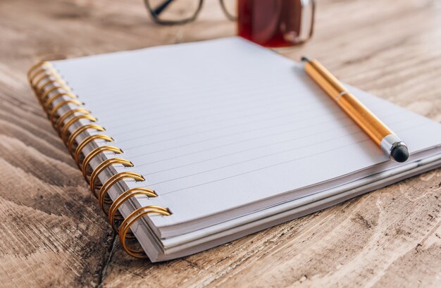 Open notebook with a pen