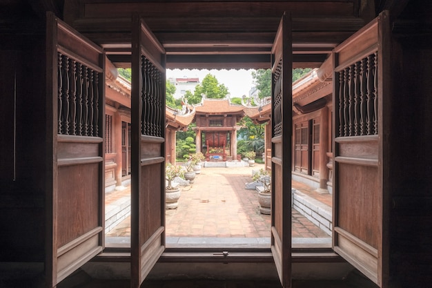 Open old wooden door in temple