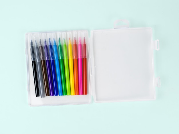 Open package with a set of markers on a light background. Universal markers for school and office.