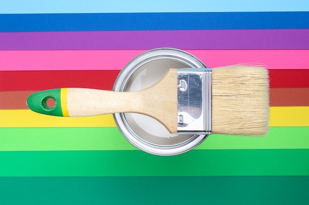 Open paint enamel cans on color palette samples