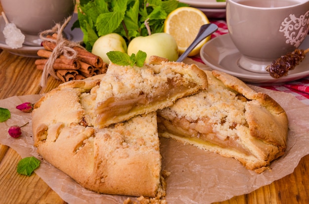 Open pie or galette with apples with cinnamon and crumbs