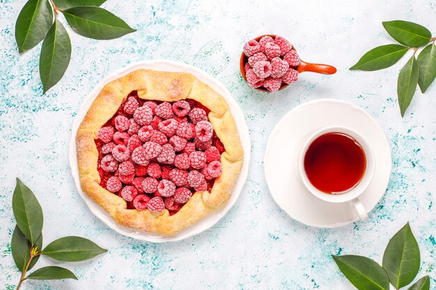 Open pie, raspberry galette. Summer berry dessert.