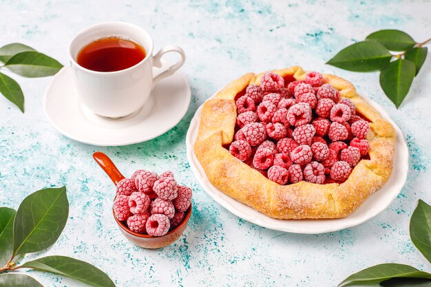 Open pie, raspberry galette. Summer berry dessert.