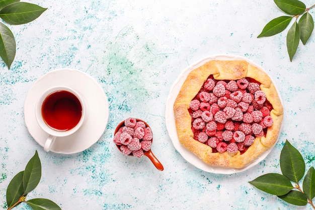 Open pie, raspberry galette. Summer berry dessert.