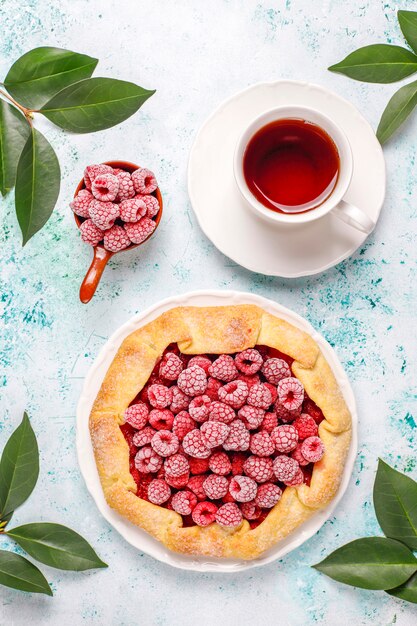 Open pie, raspberry galette. Summer berry dessert.