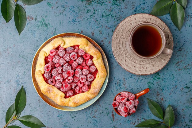 Open pie, raspberry galette. Summer berry dessert.