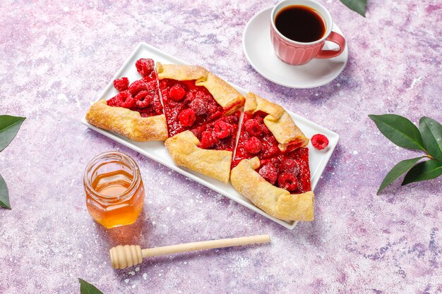 Open pie, raspberry galette. Summer berry dessert.