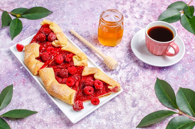 Open pie, raspberry galette. Summer berry dessert.