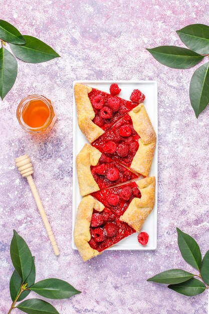 Open pie, raspberry galette. Summer berry dessert.