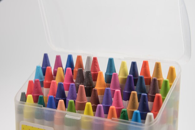 open plastic box colorful of crayon