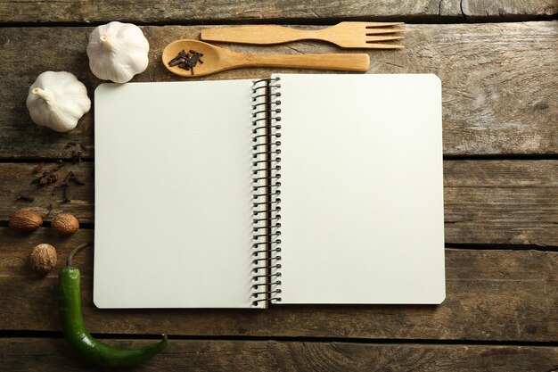 Open recipe book on wooden background