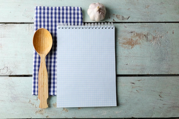 Open recipe book on wooden background