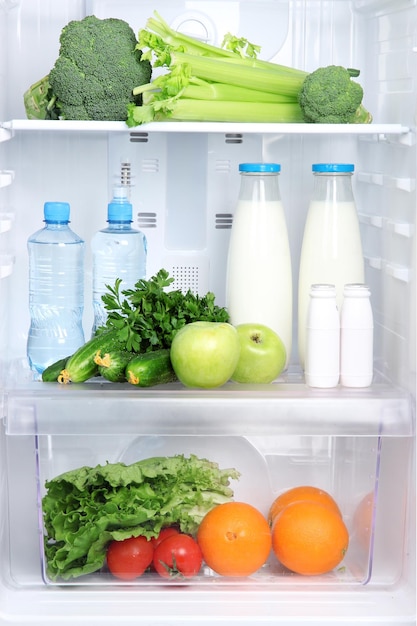 Open refrigerator with vegetarian food