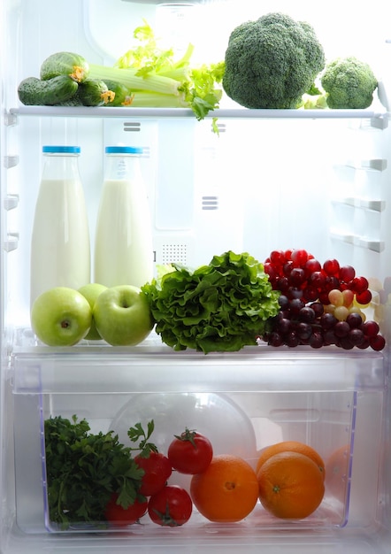 Open refrigerator with vegetarian food