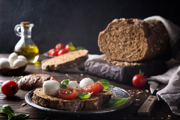 Open sandwich with tomato, mozzarella and basil