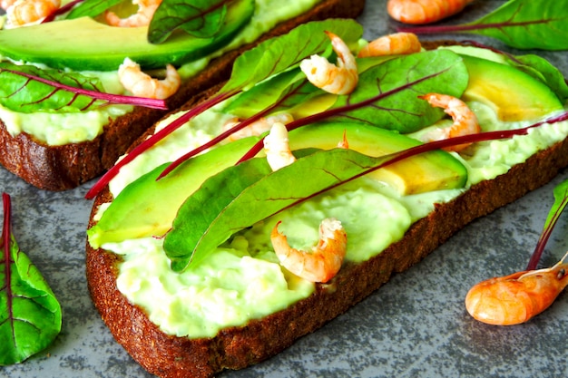 open sandwiches with avocado and shrimp.