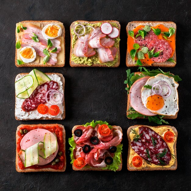 Фото open sandwiches with different meat copy space