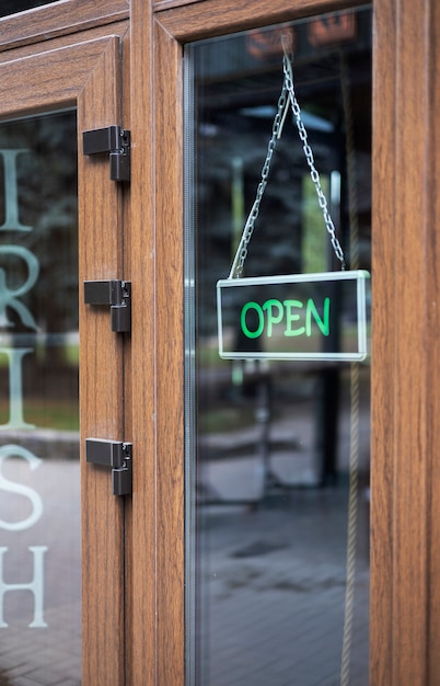 Photo open sign hanging at door