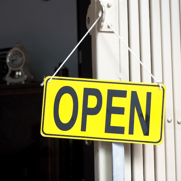 Photo open sign hanging on door