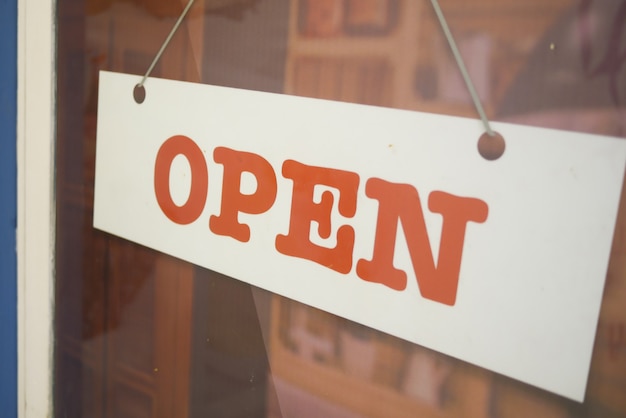 Open sign hanging front of cafe