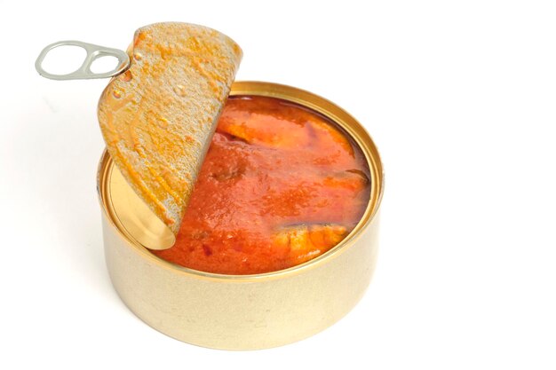 Open tin can with fish in tomato on white background