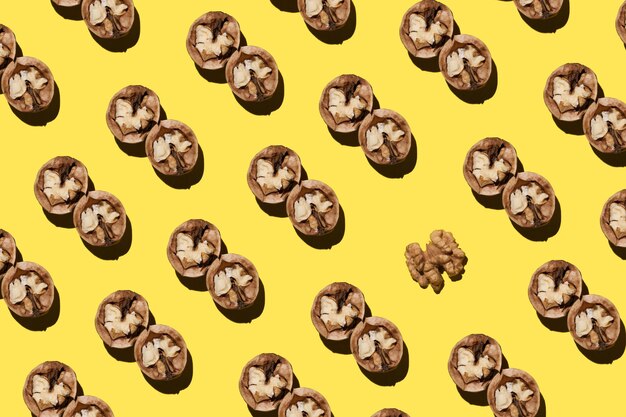 open walnuts Pattern on a yellow background