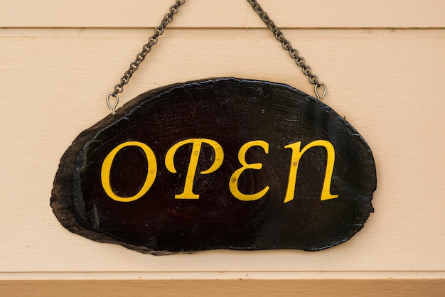 open word on wooden board hang on the wall.