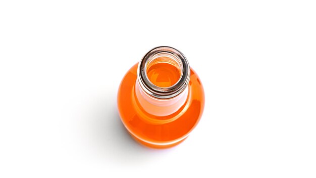 Opened bottle of orange drink on a white background