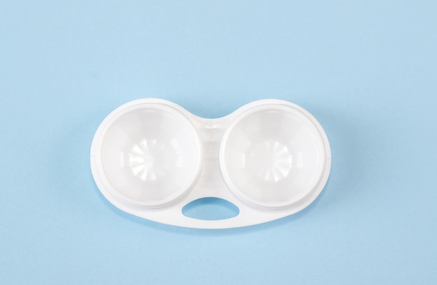 Opened contact lenses container on a blue background no cover mazed emoticon