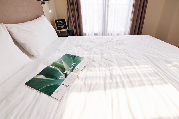 Photo opened magazine on hotel bed