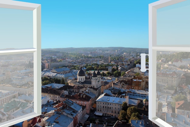 Opened window with view of the roofs of city