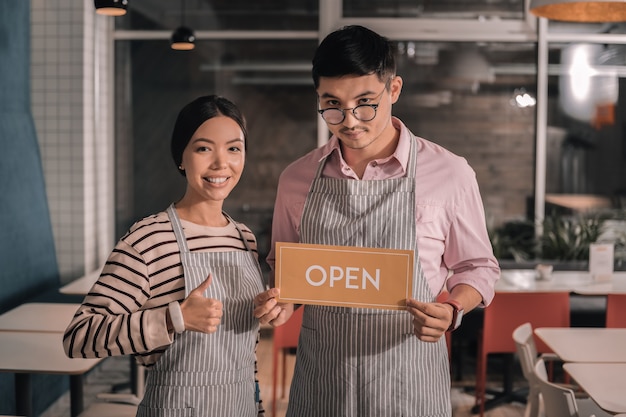 Opening cafeteria. Couple of promising entrepreneurs opening their own little cozy cafeteria