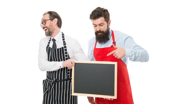 Opening soon Men bearded hipster informing you Men bearded bartender or cook in apron hold blank chalkboard Workers wanted Bartender with blackboard Hipster bartender show blackboard copy space