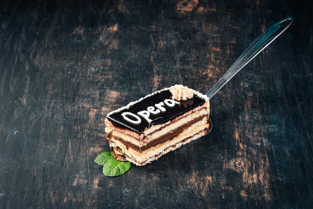 Opera Chocolate Cake On a wooden background Top view Copy space