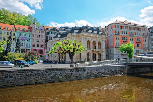 Opera House and Bridge above Tepla River in Karlovy Vary, Chech republic. People on the background.