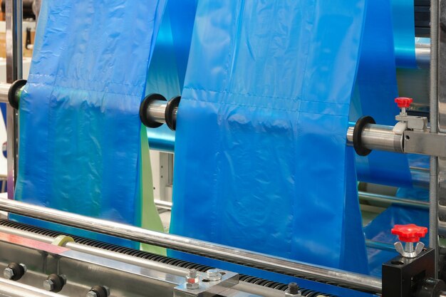 The operation of automatic plastic bag production machine.
close-up of the roller of the polyethylene bag production machine.
machine for packaging with cellophane