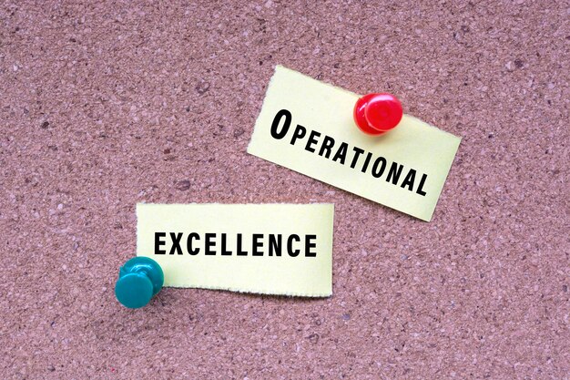 Operational excellence words on stick note and pinned to a cork notice board business concept