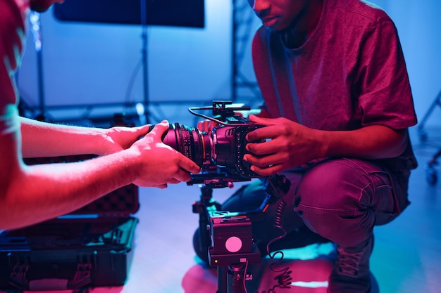 Operator setting the camera with his assistant