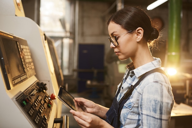 Operator with tablet pc in the plant